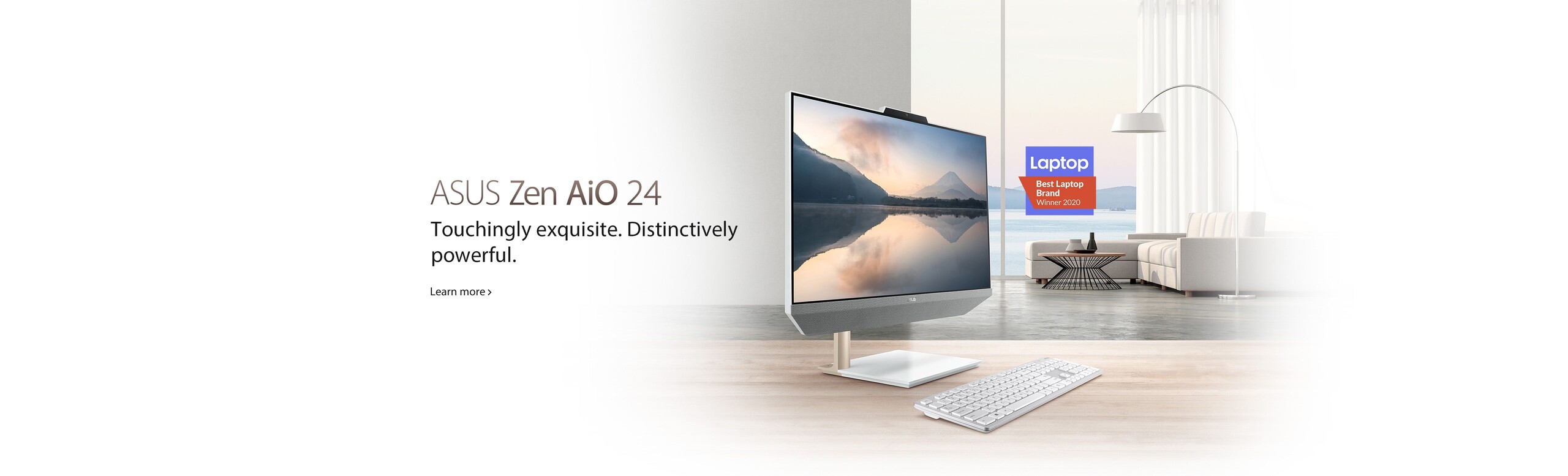 Image of Zen AiO 24 M5401 with couch and coffee table with floor lamp in the background.  Best Laptop Brand Winner 2020 logo.  ASUS Zen AiO 24  Touchingly exquisite.  Distinctively powerful.  Learn more >