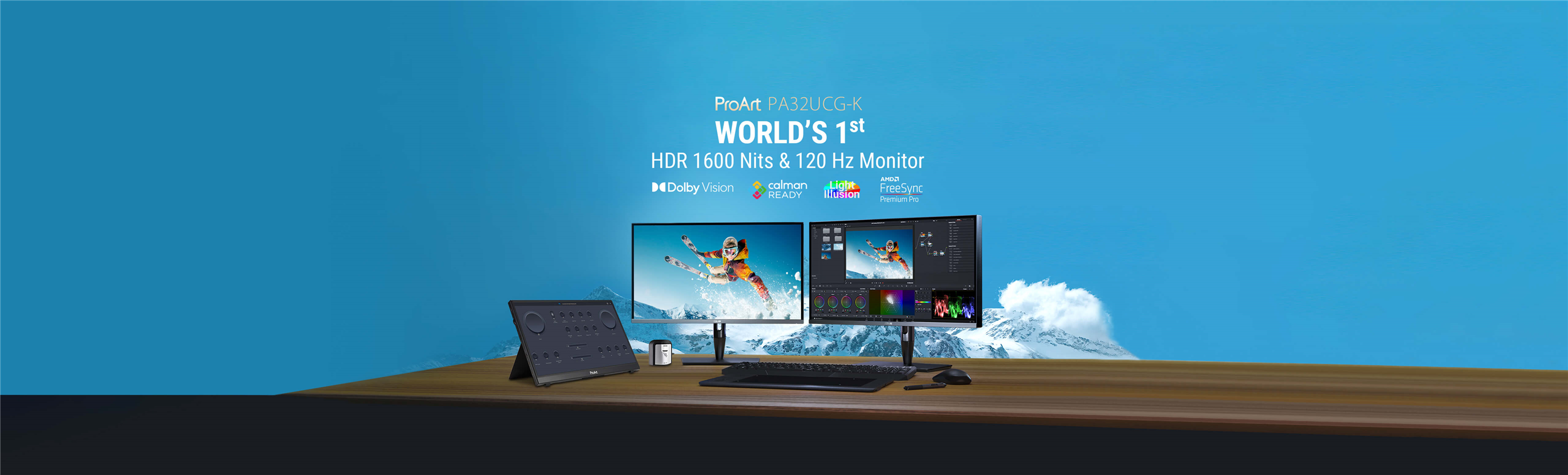 ProArt PA32UCG-K World's 1st HDR 1600 Nits & 120 HZ Monitor 2 Monitor, a kehboard, a mouse and a tablet on desk