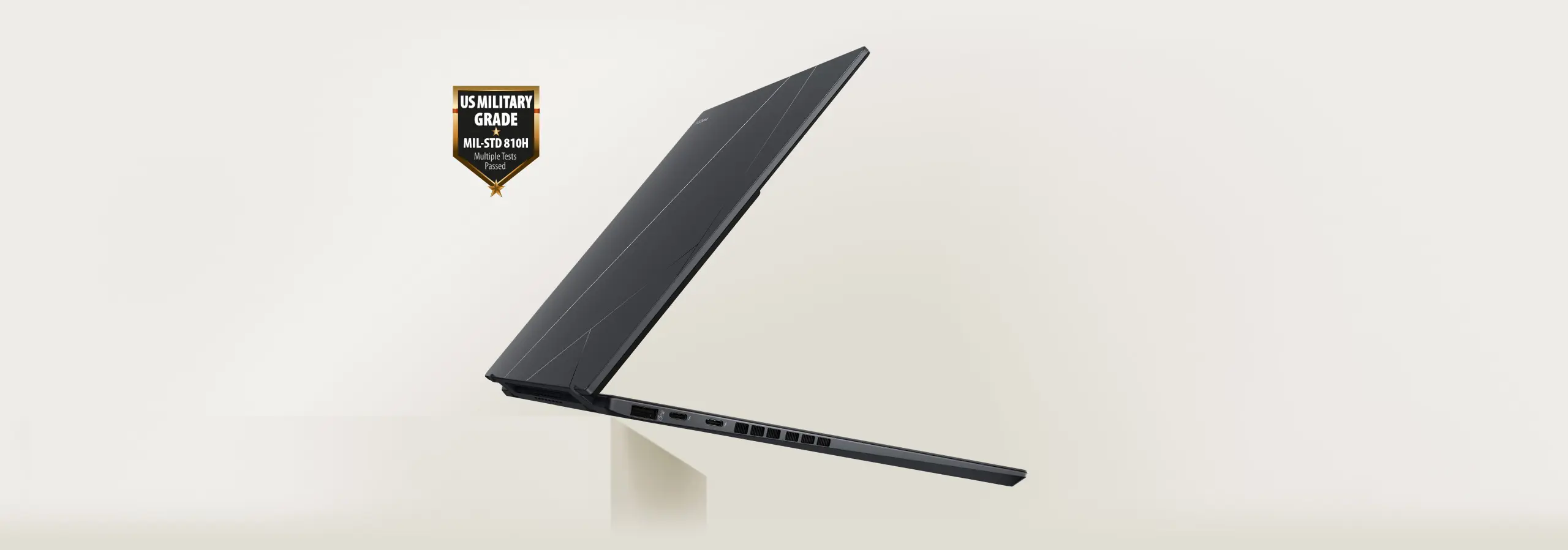 Zenbook DUO laptop is floating in mid-air with US military garde laptop durability icon next to it.