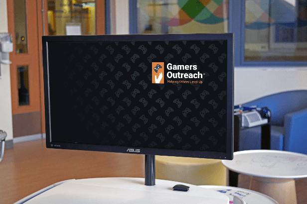 Asus Monitor displaying the Gamers Outreach logo