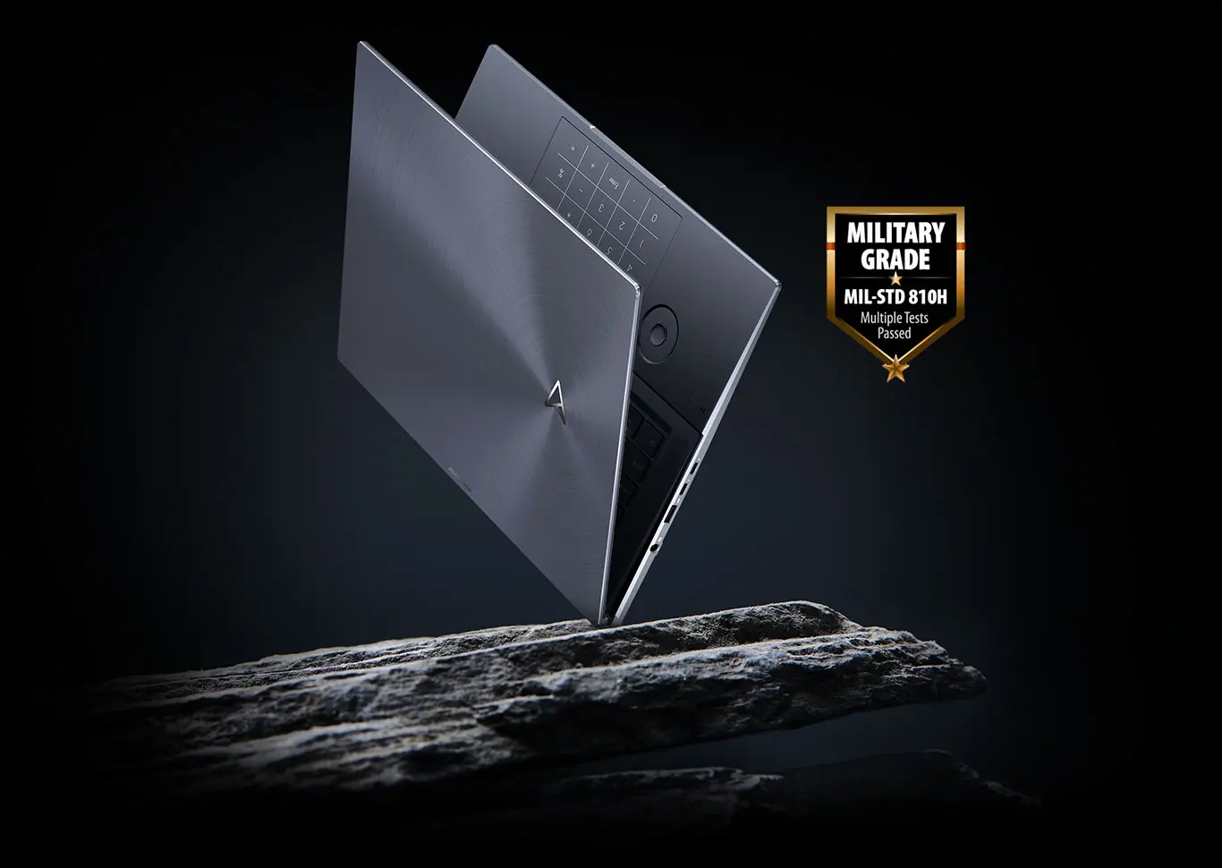 ASUS Zenbook Pro laptop floating in mid-air with US military grade MIL-STD 810H badge on the side
